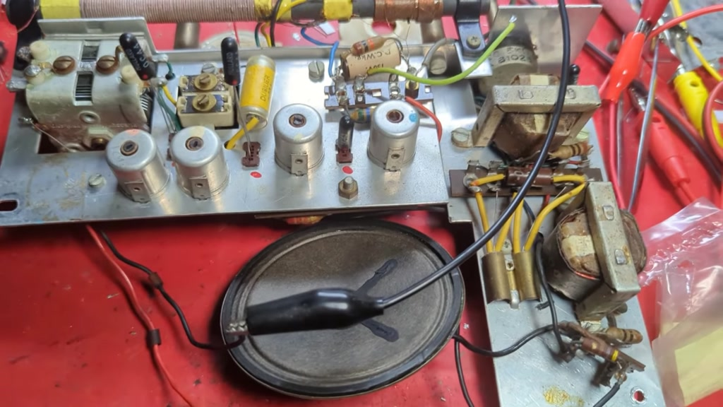 Transistors in sockets and a small speaker connected up for testing