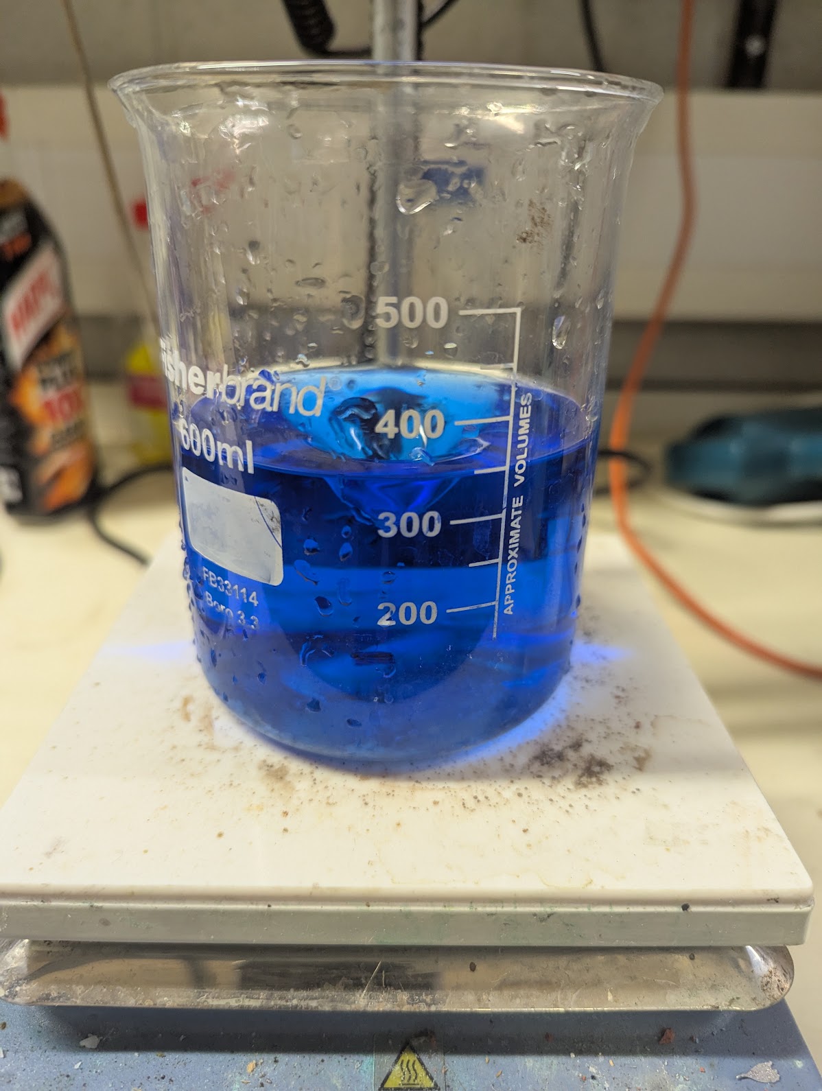 20ml of Harpic in 300ml of water makes a nice blue solution