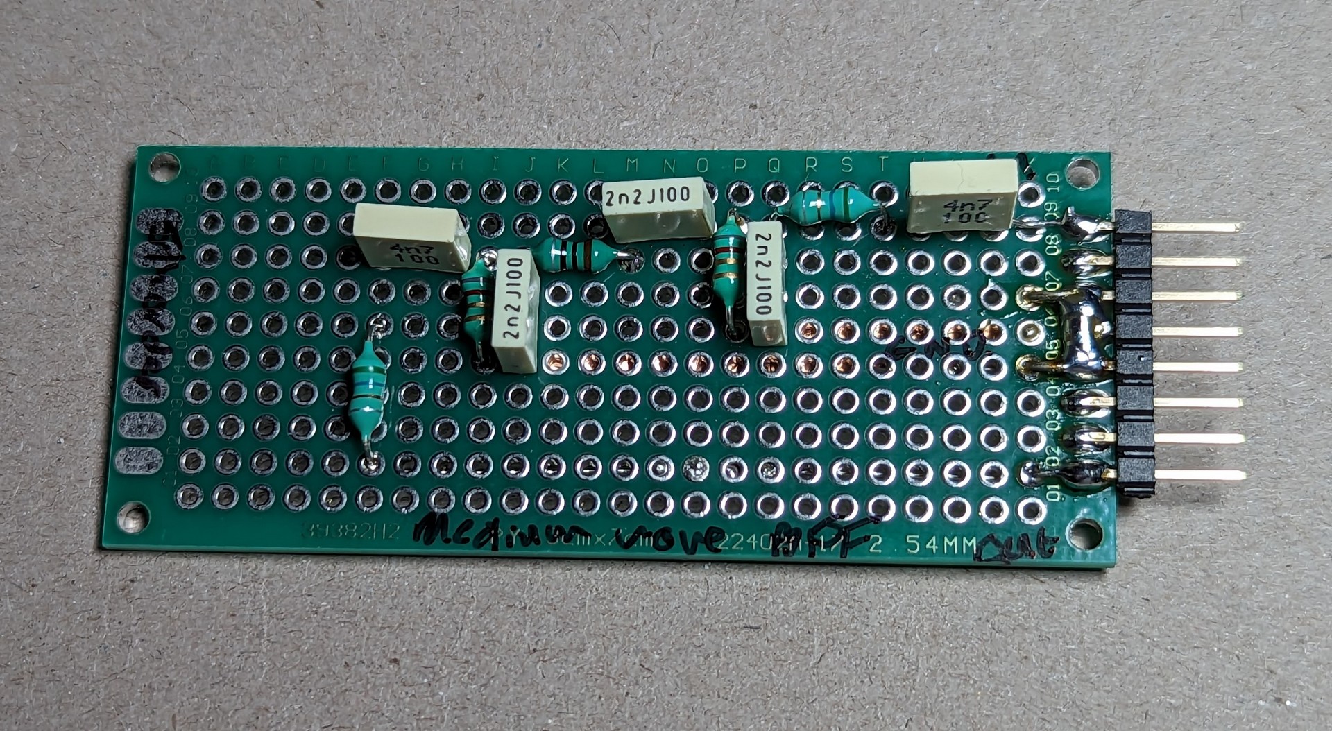 Filter rebuilt on protoboard. Input is top right, ground is the three central pins and output is the bottom right pin.