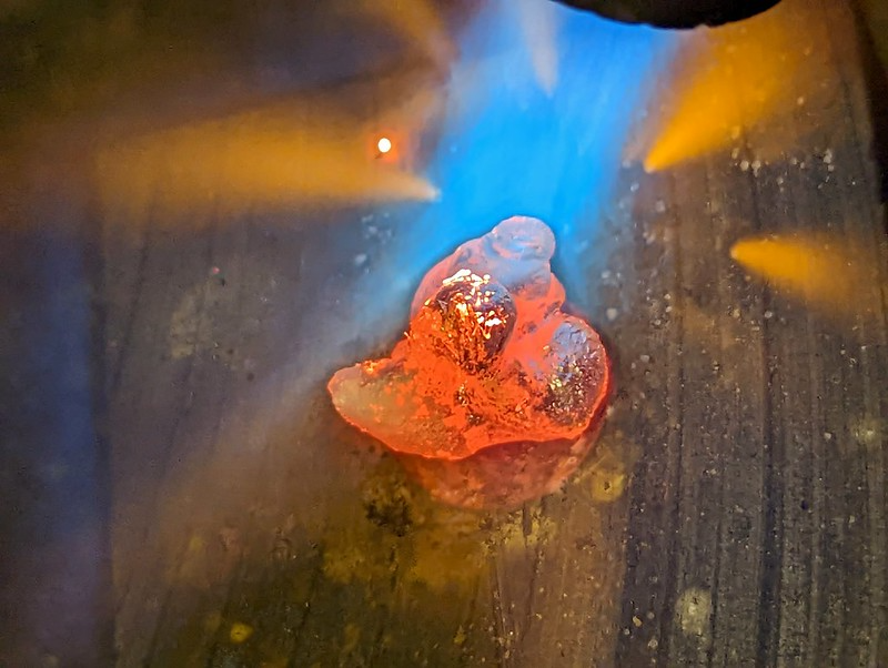 Heating the silver lump on a graphite block